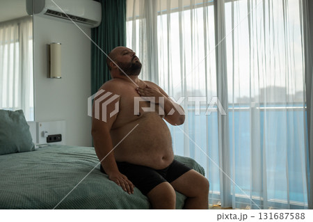 Frustrated man suffer from obese has problem with health, diabetes, difficult breathing, cholesterol 131687588