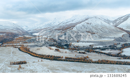 Cold and snowy mountainous panoramic landscape. Cold and snowy mountainous panoramic landscape. 131689245
