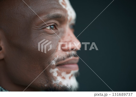 Portrait of a man with facial patterns expressing calmness and confidence in a soft light 131689737