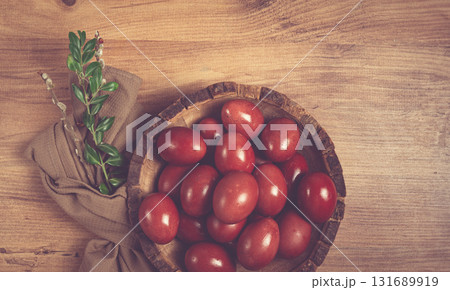 painted eggs in a wooden bowl, red, painted madder dye, powder from the roots of endro, with onion husks, top view, Easter, Georgia, painted eggs in a wooden bowl, red, painted madder dye, powder from the roots of endro, with onion husks, top view, Easter, Georgia, 131689919
