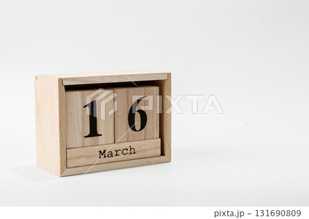 Wooden calendar March16 on a white background 131690809