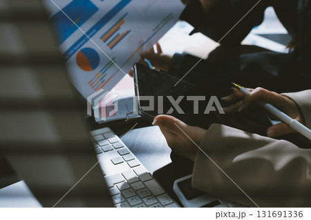 Close up high angle Asian businesswoman working with her coworker in meeting room Close up high angle Asian businesswoman working with her coworker in meeting room 131691336