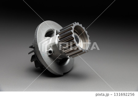 Top-quality parts for your car. Car maintenance. New water pump for a car's engine cooling system on a gray gradient background. Top-quality parts for your car. Car maintenance. New water pump for a car's engine cooling system on a gray gradient background. 131692256