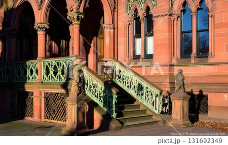 Ornate Red Brick Building with Green Railings and Sculptural Det Ornate Red Brick Building with Green Railings and Sculptural Det 131692349