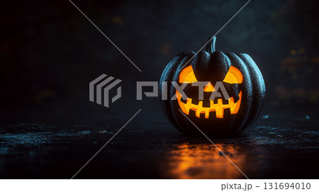 A glowing carved pumpkin with a sinister face is set against a dark, eerie background. Concept of Halloween. For seasonal or holiday-themed promotions. A glowing carved pumpkin with a sinister face is set against a dark, eerie background. Concept of Halloween. For seasonal or holiday-themed promotions. 131694010
