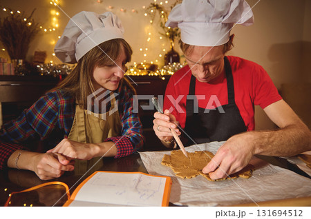Cooking Duo: Family Friends Team Up in Festive Kitchen Cooking Duo: Family Friends Team Up in Festive Kitchen 131694512