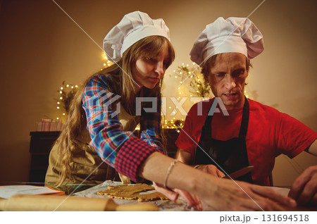 Professional Chefs In White Hats Baking Cookies Together For Christmas Professional Chefs In White Hats Baking Cookies Together For Christmas 131694518