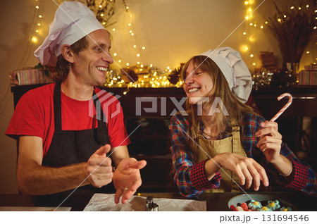 Happy Chefs Share Holiday Joy In Cozy Kitchen As They Bake And Laugh Happy Chefs Share Holiday Joy In Cozy Kitchen As They Bake And Laugh 131694546