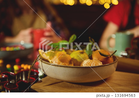 Fruit Bowl Of Citrus And Peels On Wooden Table In Cozy Evening With Friends 131694563