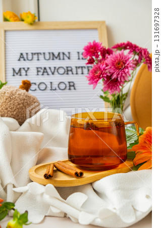 Saying AUTUMN IS MY FAVORITE COLOR in letter board Selective focus Bush of autumnal orange red chrysanthemums and violet dahlia hydrangea. Fall garden beautiful flowers bouquet background. Blooming 131697328