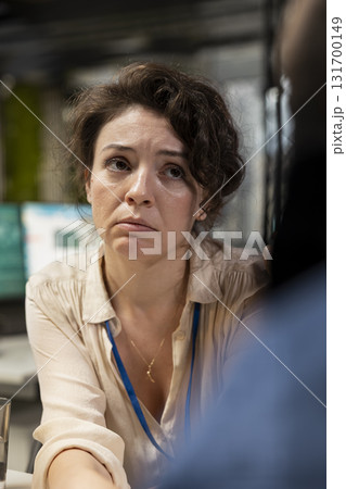 Woman team leader being exasperated due to work pressure and chaos, struggling to save the business image. Worried displeased boss feels disappointed with her staff, job tension. 131700149