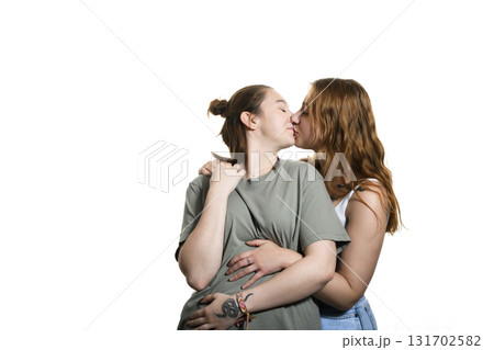 Happy lesbian couple on studio white background. Happy lesbian couple on studio white background. 131702582