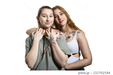 Happy lesbian couple on studio white background. Happy lesbian couple on studio white background. 131702584