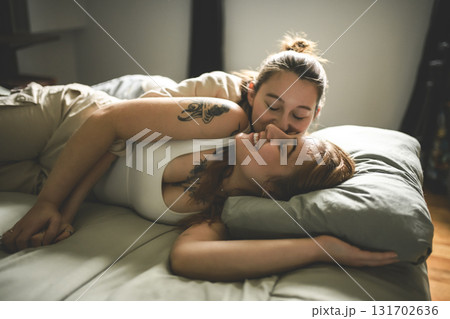 Happy couple having great time close to a window at home 131702636
