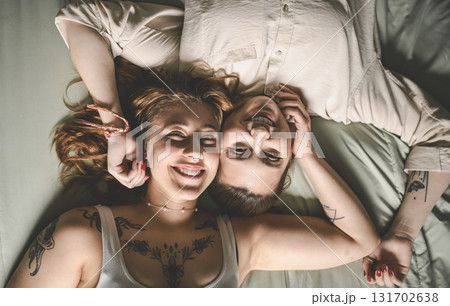 Happy couple having great time close to a window at home 131702638