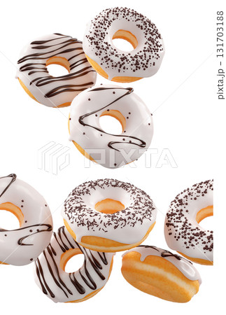 Donuts with white chocolate glaze, sprinkles, white drizzle, and dots isolated on white transparent background Donuts with white chocolate glaze, sprinkles, white drizzle, and dots isolated on white transparent background 131703188