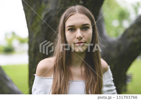 Portrait of teenage girl in casual t-shirt outside on summer season 131703766