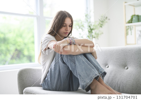 Depression in teenage concept, Young girl feeling anxious and unhappy. Depression in teenage concept, Young girl feeling anxious and unhappy. 131704701