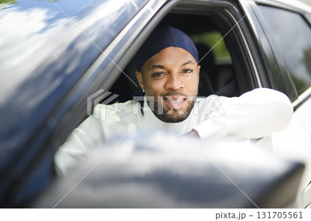 portrait of happy black american man driving car 131705561