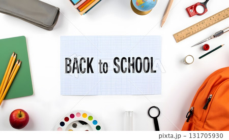 Colorful Back to School Essentials with Stationery and Backpack on a Table 131705930