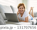 Happy modern European senior woman using laptop 131707656