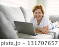 Happy modern European senior woman using laptop 131707657