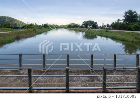 A full irrigation canal ready to supply water to agricultural areas. A full irrigation canal ready to supply water to agricultural areas. 131710005