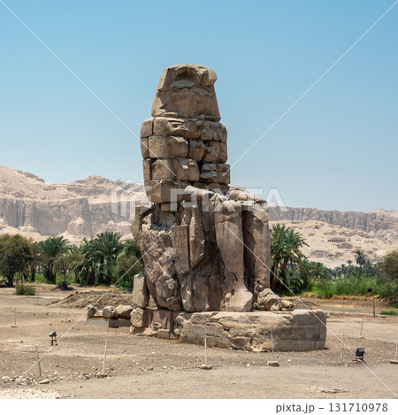 The Colossi of Memnon Standing Against a Mountainous Backdrop The Colossi of Memnon Standing Against a Mountainous Backdrop 131710978