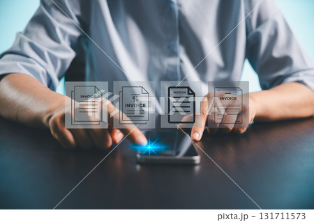 Businesswoman manages electronic statements, digital receipts on virtual screen, utilizing concept of e-invoice, digital billing, online invoice processing as smart e-tax and tax accounting solutions. 131711573