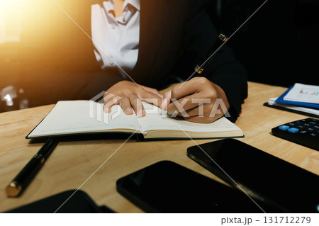 Accounting company provide finance and taxation planning for profitable cash flow, Auditor and accountant team working in office, analyze financial data and accounting record with calculator.Insight Accounting company provide finance and taxation planning for profitable cash flow, Auditor and accountant team working in office, analyze financial data and accounting record with calculator.Insight 131712279