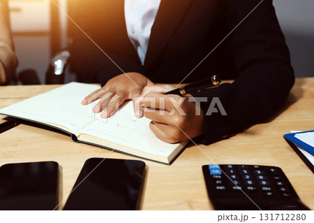 Accounting company provide finance and taxation planning for profitable cash flow, Auditor and accountant team working in office, analyze financial data and accounting record with calculator.Insight Accounting company provide finance and taxation planning for profitable cash flow, Auditor and accountant team working in office, analyze financial data and accounting record with calculator.Insight 131712280