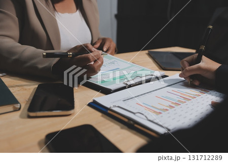 Accounting company provide finance and taxation planning for profitable cash flow, Auditor and accountant team working in office, analyze financial data and accounting record with calculator.Insight Accounting company provide finance and taxation planning for profitable cash flow, Auditor and accountant team working in office, analyze financial data and accounting record with calculator.Insight 131712289