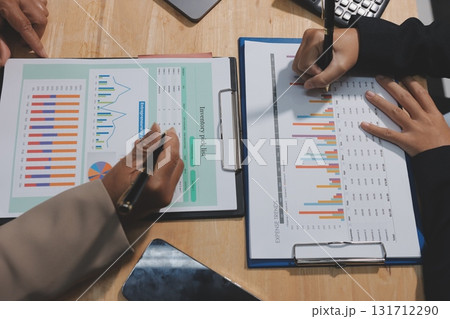 Accounting company provide finance and taxation planning for profitable cash flow, Auditor and accountant team working in office, analyze financial data and accounting record with calculator.Insight Accounting company provide finance and taxation planning for profitable cash flow, Auditor and accountant team working in office, analyze financial data and accounting record with calculator.Insight 131712290