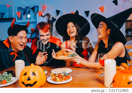 Joyful office Halloween party with coworkers in costumes, celebrating with drinks and laughter, fostering teamwork and festive spirit Joyful office Halloween party with coworkers in costumes, celebrating with drinks and laughter, fostering teamwork and festive spirit 131712965