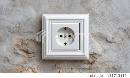 Electrical outlet installed on textured wall with vintage design elements 131713115