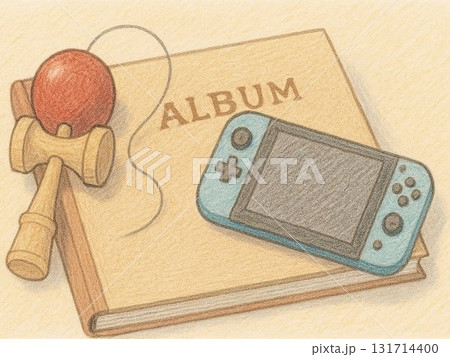 アルバムの上の使えない今昔遊具(けん玉とゲーム機) アルバムの上の使えない今昔遊具(けん玉とゲーム機) 131714400