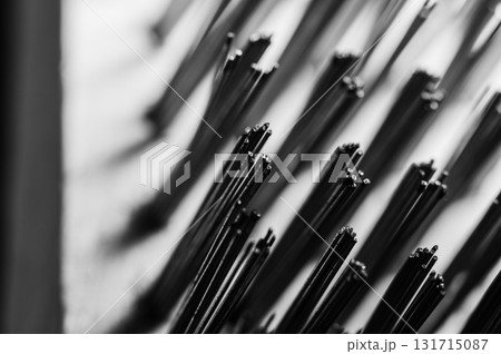 The hard metal brush is set against a dark background The hard metal brush is set against a dark background 131715087