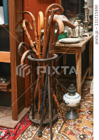 A variety of walking sticks at a vintage store 131715990