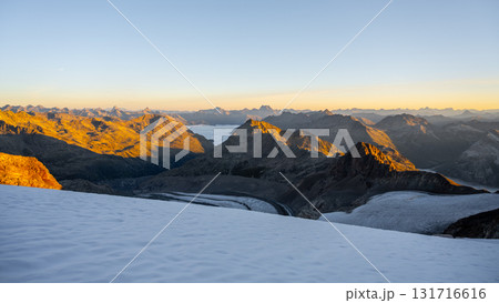 The majestic Pers Glacier in the Bernina Range glows in the morning light. Surrounding peaks rise sharply, showcasing the impressive beauty of the Swiss Alps in Graubunden. The majestic Pers Glacier in the Bernina Range glows in the morning light. Surrounding peaks rise sharply, showcasing the impressive beauty of the Swiss Alps in Graubunden. 131716616