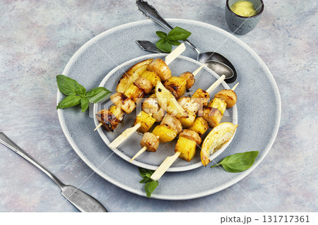 Sea scallops on skewers, delicious barbecue. 131717361