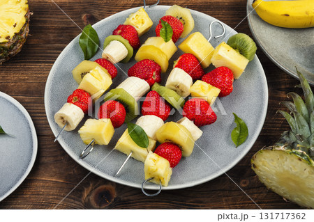 Fruit on skewer, appetizers mini snacks. 131717362