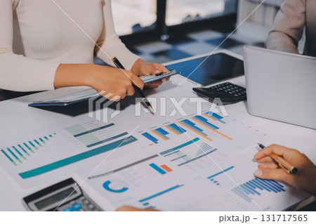 Accounting company provide finance and taxation planning for profitable cash flow, Auditor and accountant team working in office, analyze financial data and accounting record with calculator.Insight 131717565