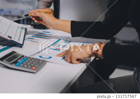 Accounting company provide finance and taxation planning for profitable cash flow, Auditor and accountant team working in office, analyze financial data and accounting record with calculator.Insight 131717567