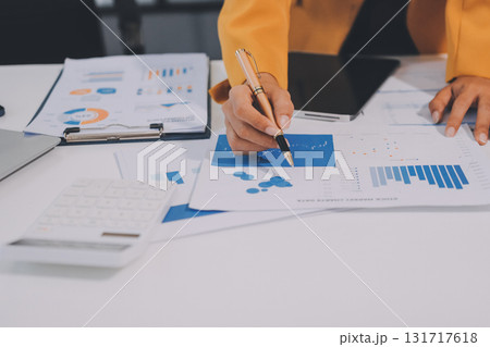 Accounting company provide finance and taxation planning for profitable cash flow, Auditor and accountant team working in office, analyze financial data and accounting record with calculator.Insight 131717618