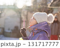 Outdoor winter fun blowing soap bubbles 131717777