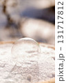 Delicate frozen soap bubble on winter snow surface 131717812
