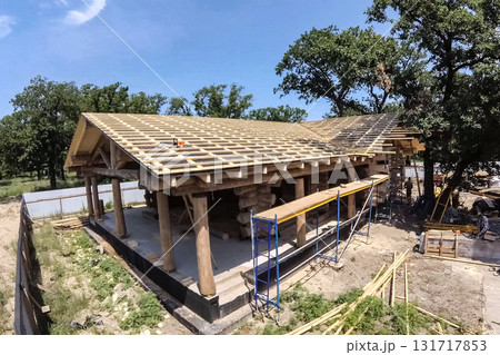 Stage of construction of a wooden house. Stage of construction of a wooden house. 131717853