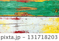 The of a Texture of vintage wood boards with cracked paint of white, red, yellow and light green colo 131718203