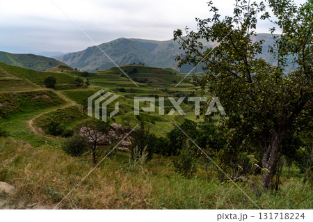 Chokhsky terraces Dagestan. Landscape of mountainous Dagestan with terraced fields and peaks mountains in the distance. Chokhsky terraces Dagestan. Landscape of mountainous Dagestan with terraced fields and peaks mountains in the distance. 131718224