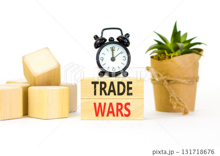 Trade wars symbol. Concept word Trade wars on beautiful wooden blocks. Beautiful white paper background. Beautiful black alarm clock. Business trade wars concept. Copy space. 131718676